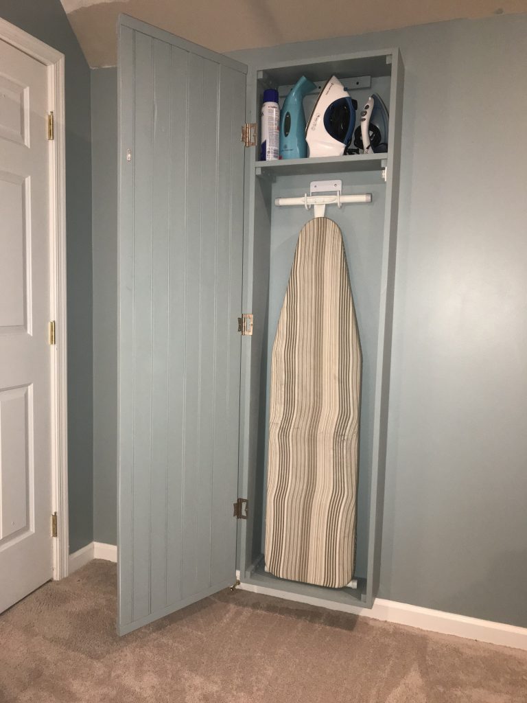 Ironing board cabinet with mirror